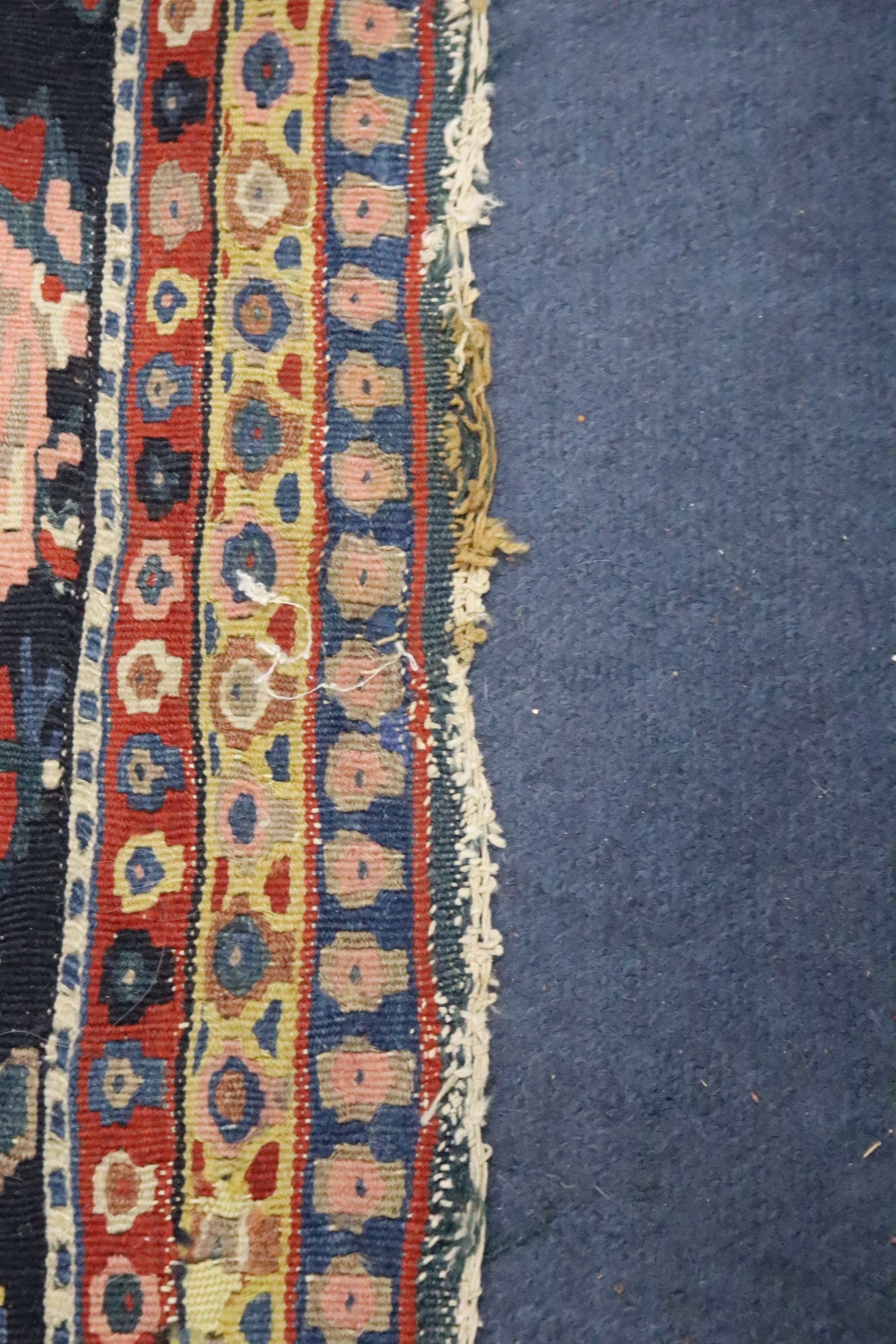 A late 19th century / early 20th century Senneh polychrome Kilim rug, 190 x 130cm